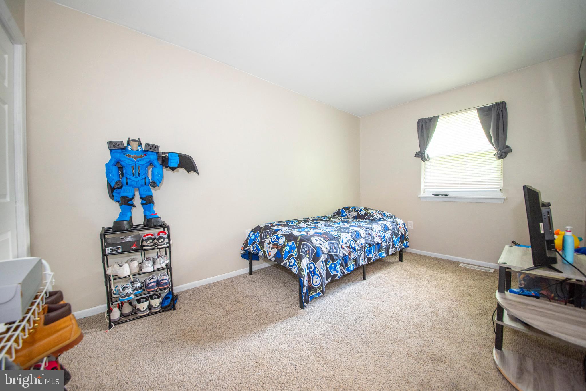 9355 Pan Ridge Road, Unit 9355 Parkville, MD 21234 - Photo 17 of 32 a bedroom with furniture and a window