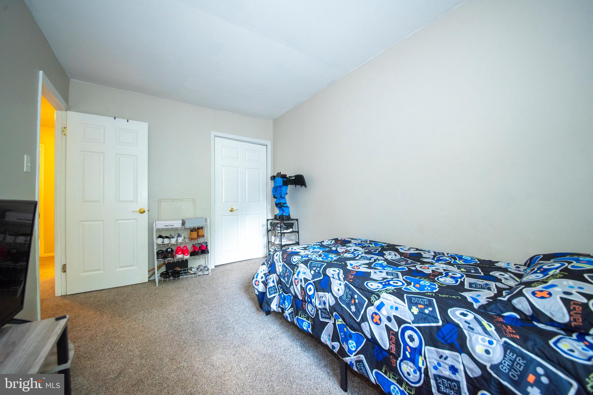 9355 Pan Ridge Road, Unit 9355 Parkville, MD 21234 - Photo 18 of 32 a bedroom with bed and a window