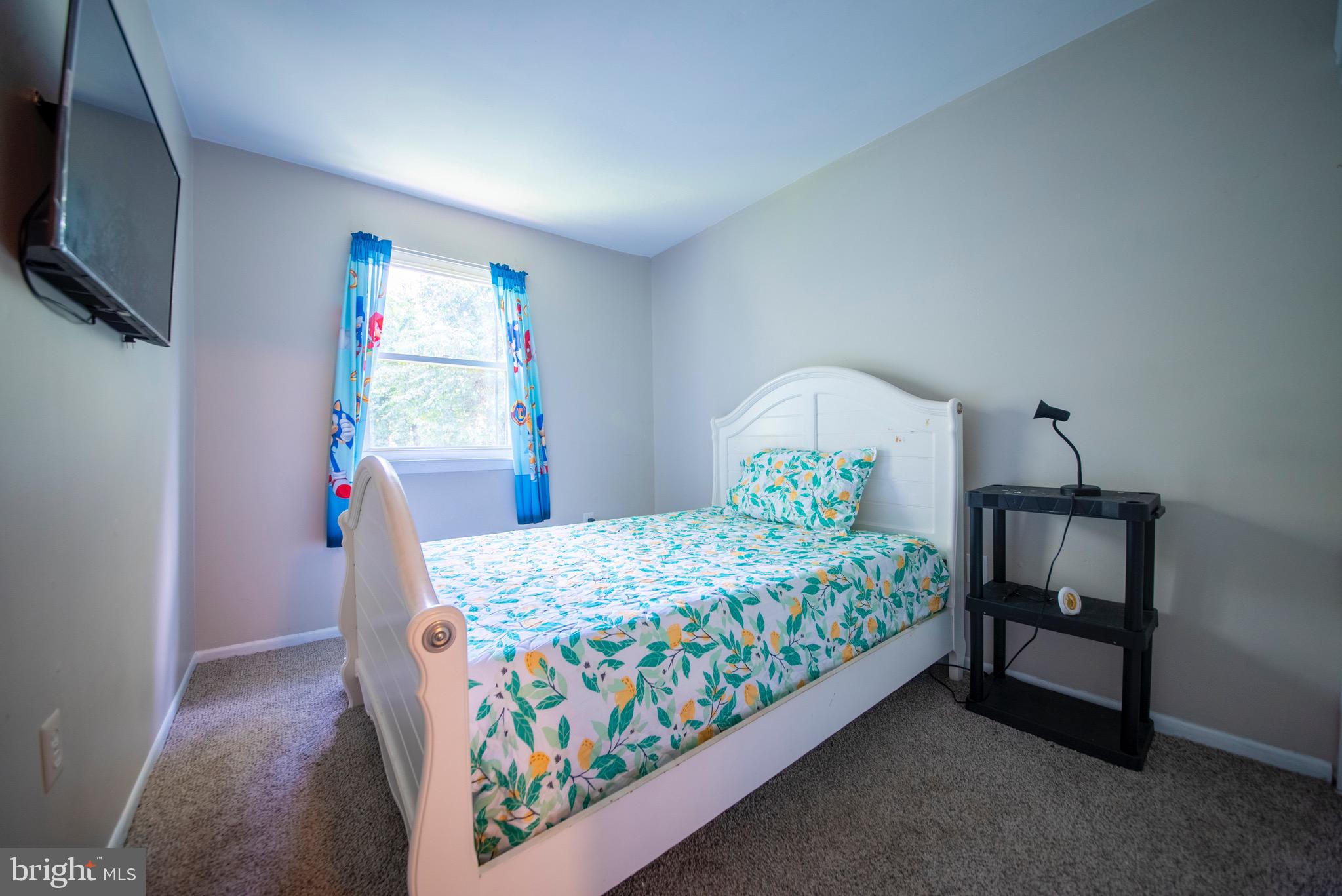 9355 Pan Ridge Road, Unit 9355 Parkville, MD 21234 - Photo 19 of 32 a bedroom with a bed and a window