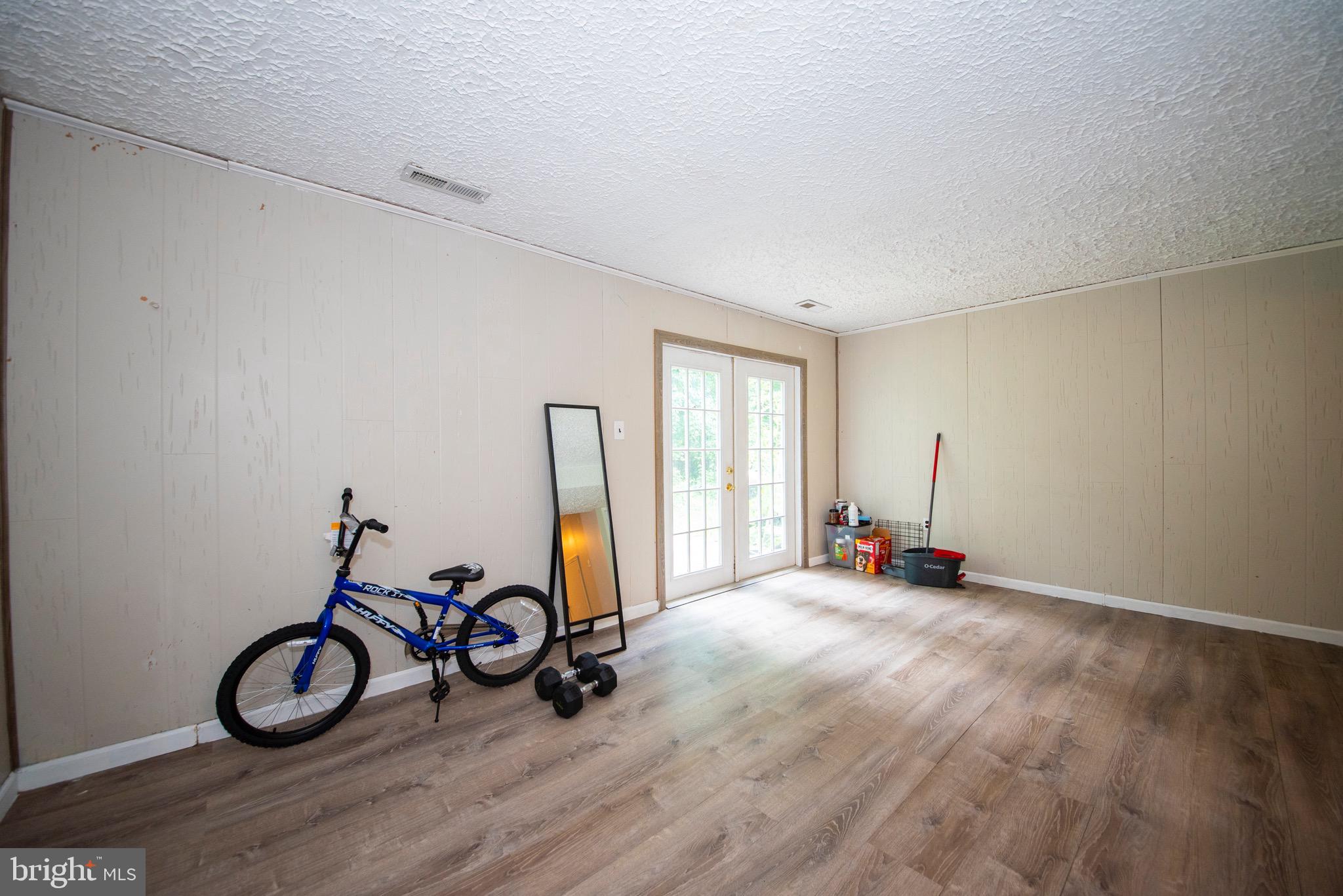 9355 Pan Ridge Road, Unit 9355 Parkville, MD 21234 - Photo 27 of 32 a view of a room with gym equipment and a large window