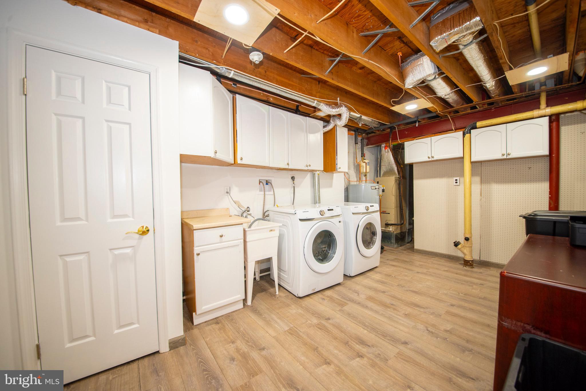 9355 Pan Ridge Road, Unit 9355 Parkville, MD 21234 - Photo 29 of 32 a utility room with dryer and washer