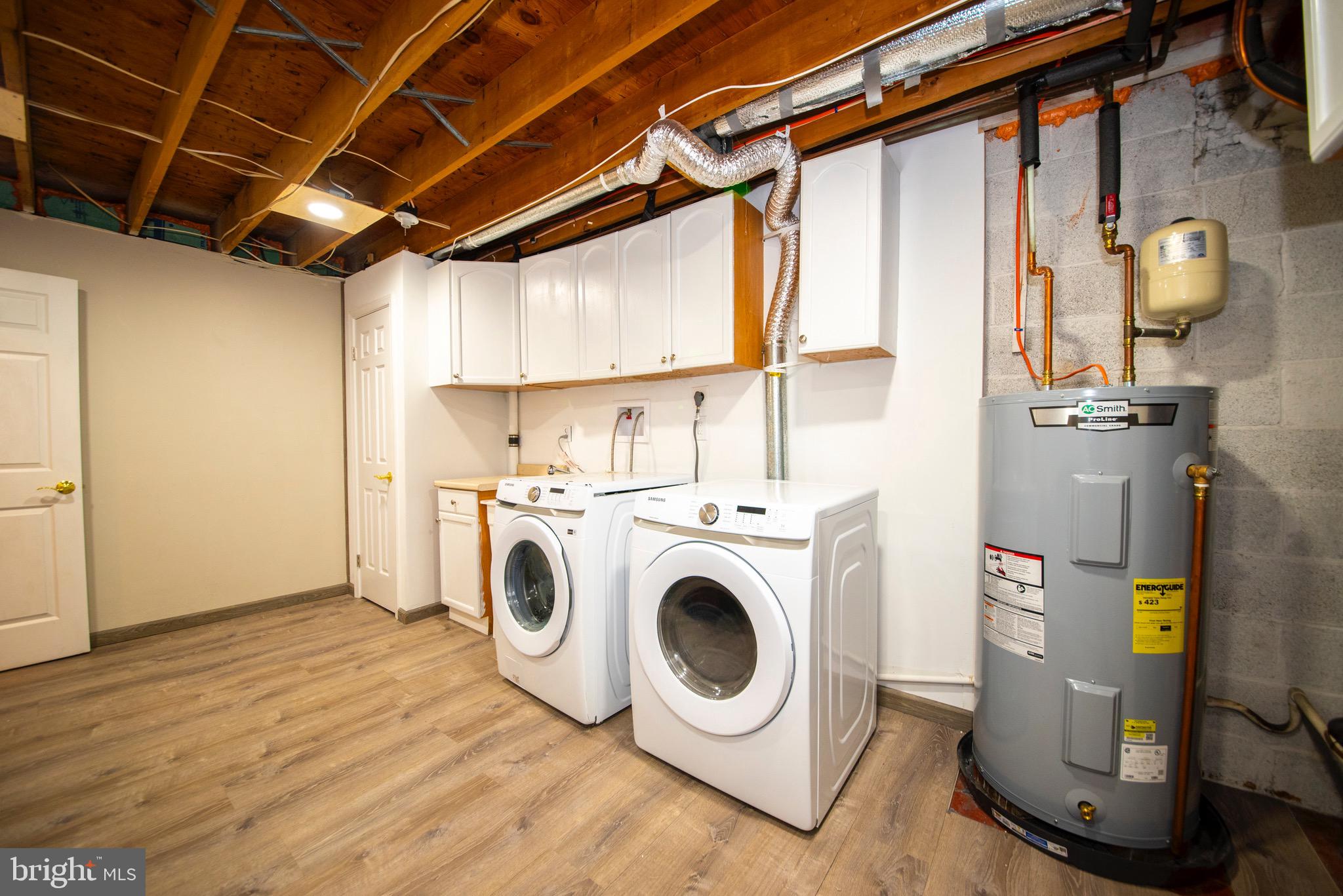 9355 Pan Ridge Road, Unit 9355 Parkville, MD 21234 - Photo 30 of 32 a utility room with dryer and washer