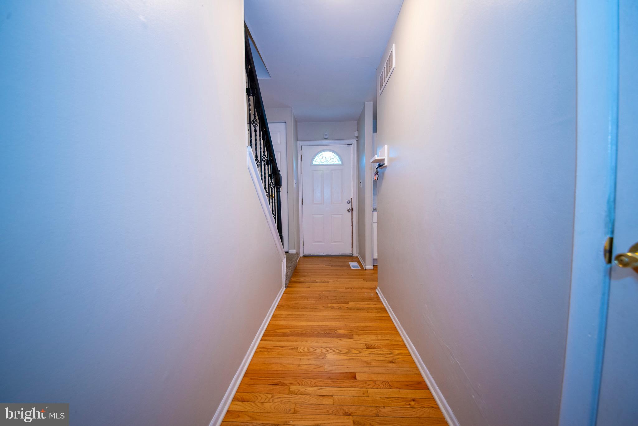 9355 Pan Ridge Road, Unit 9355 Parkville, MD 21234 - Photo 4 of 32 a view of a hallway with a white door
