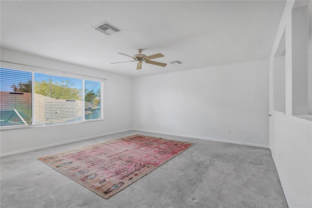 19015 Fern Meadow Loop Lutz, FL 33558 - Photo 8 of 50 a view of an empty room with a window