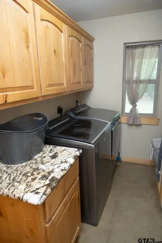 a kitchen with a stove and a white cabinet