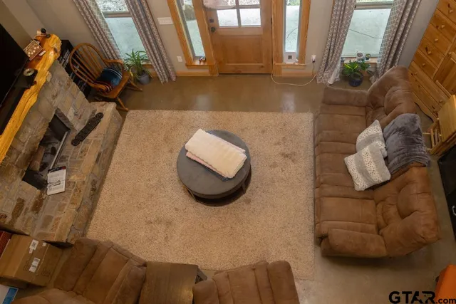 a living room with furniture and a rug