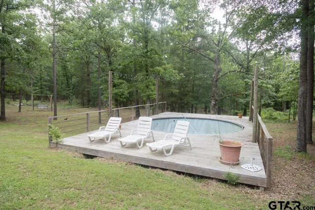 a view of a yard with a patio