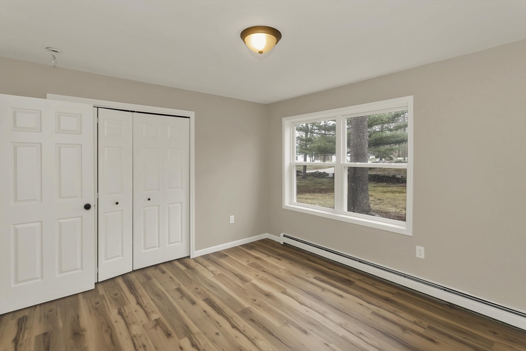 374 Rondeau Street Palmer, MA 01069 - Photo 11 of 27 a view of an empty room with wooden floor and a window