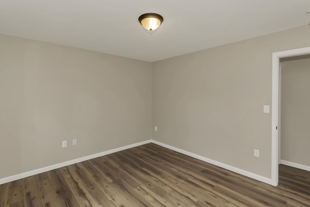 374 Rondeau Street Palmer, MA 01069 - Photo 14 of 27 a view of room with wooden floor
