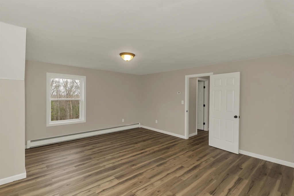 374 Rondeau Street Palmer, MA 01069 - Photo 16 of 27 a view of an empty room with wooden floor and a window
