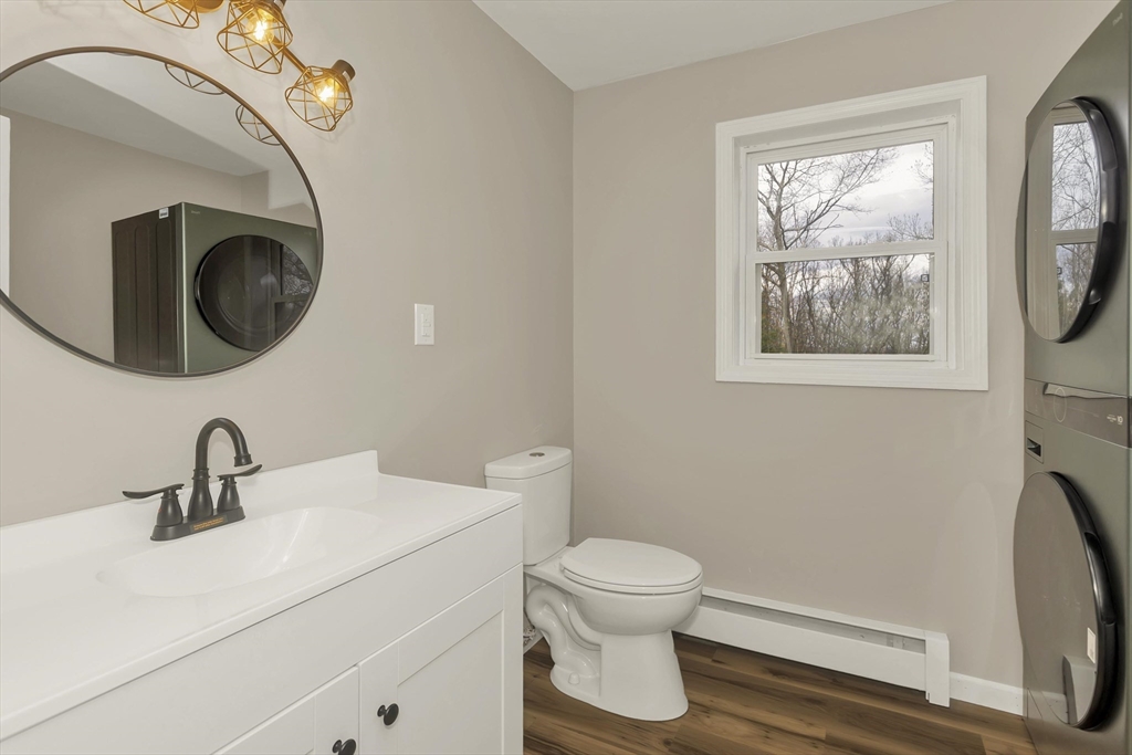 374 Rondeau Street Palmer, MA 01069 - Photo 19 of 27 a bathroom with a toilet sink and mirror