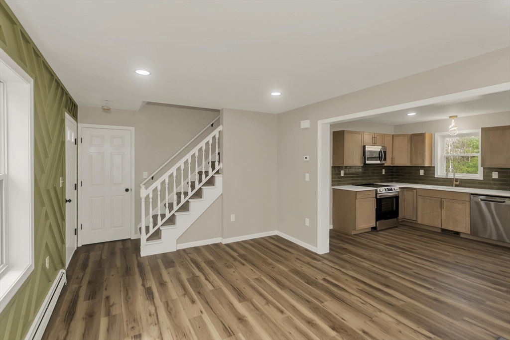 374 Rondeau Street Palmer, MA 01069 - Photo 7 of 27 a view of kitchen with wooden floor and electronic appliances