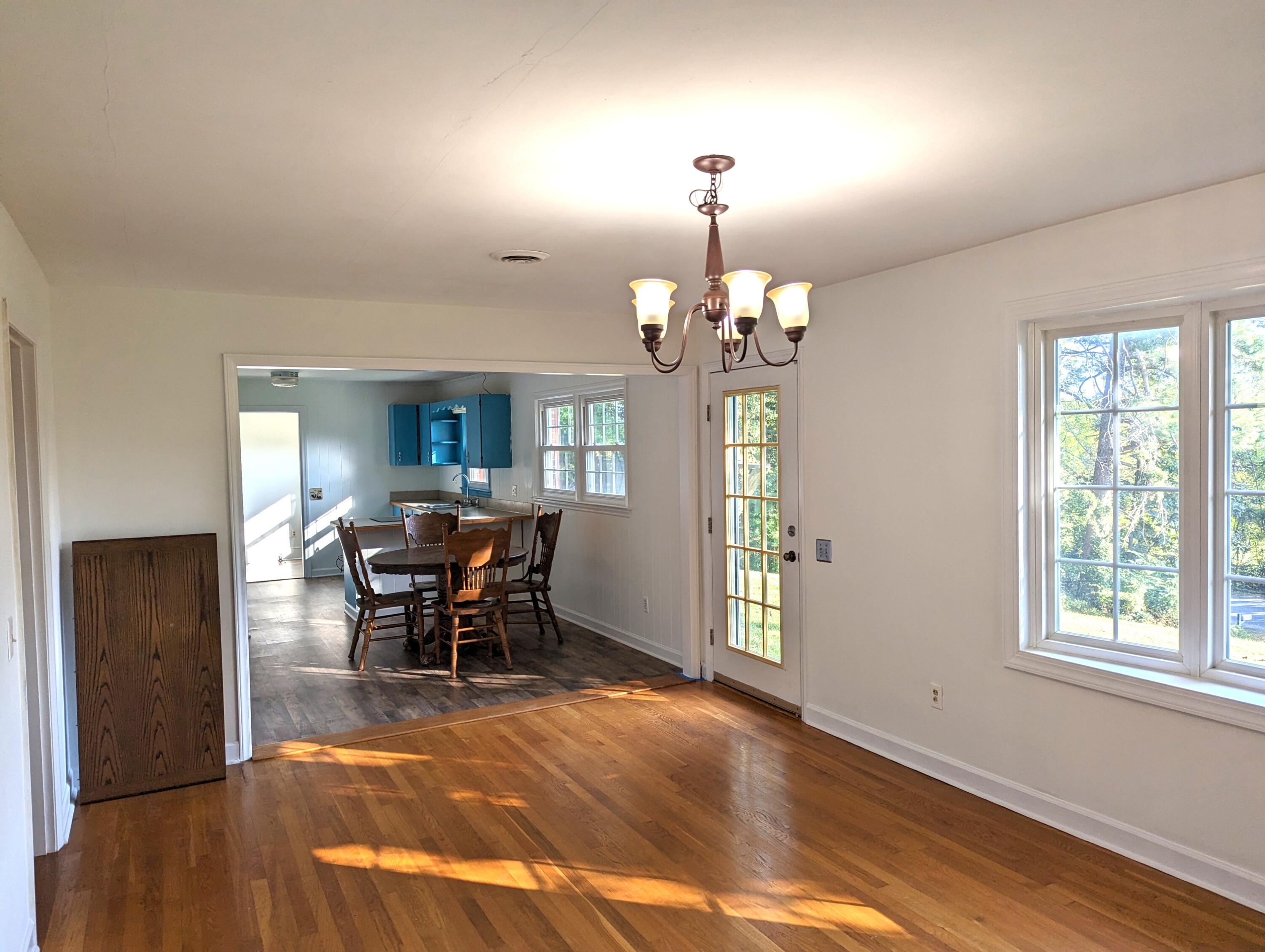 1769 Factory Hill Road Callaway, VA 24067 - Photo 11 of 53 a view of a dining room with furniture and chandelier