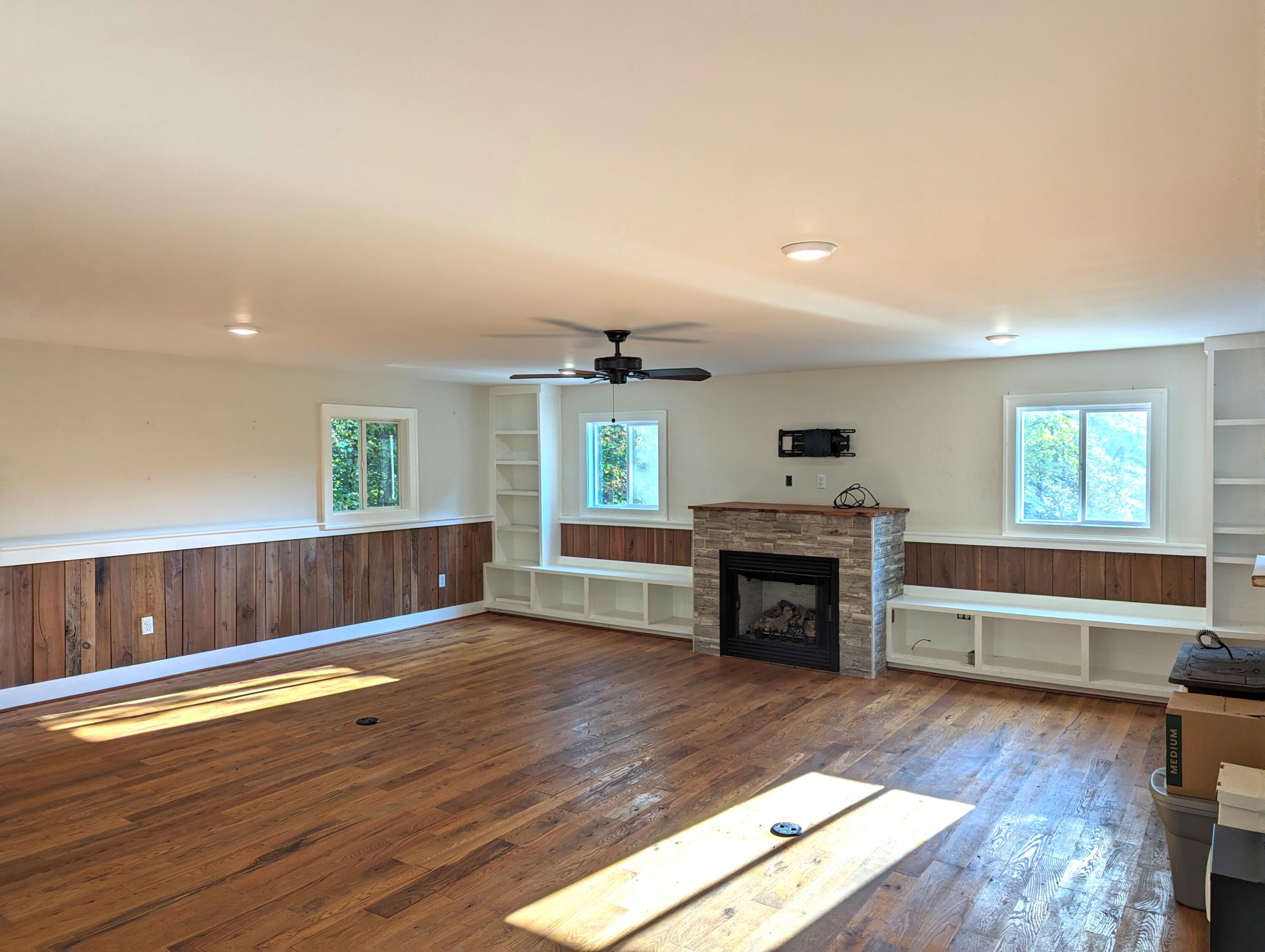 1769 Factory Hill Road Callaway, VA 24067 - Photo 21 of 53 a view of an empty room with wooden floor fireplace and a window