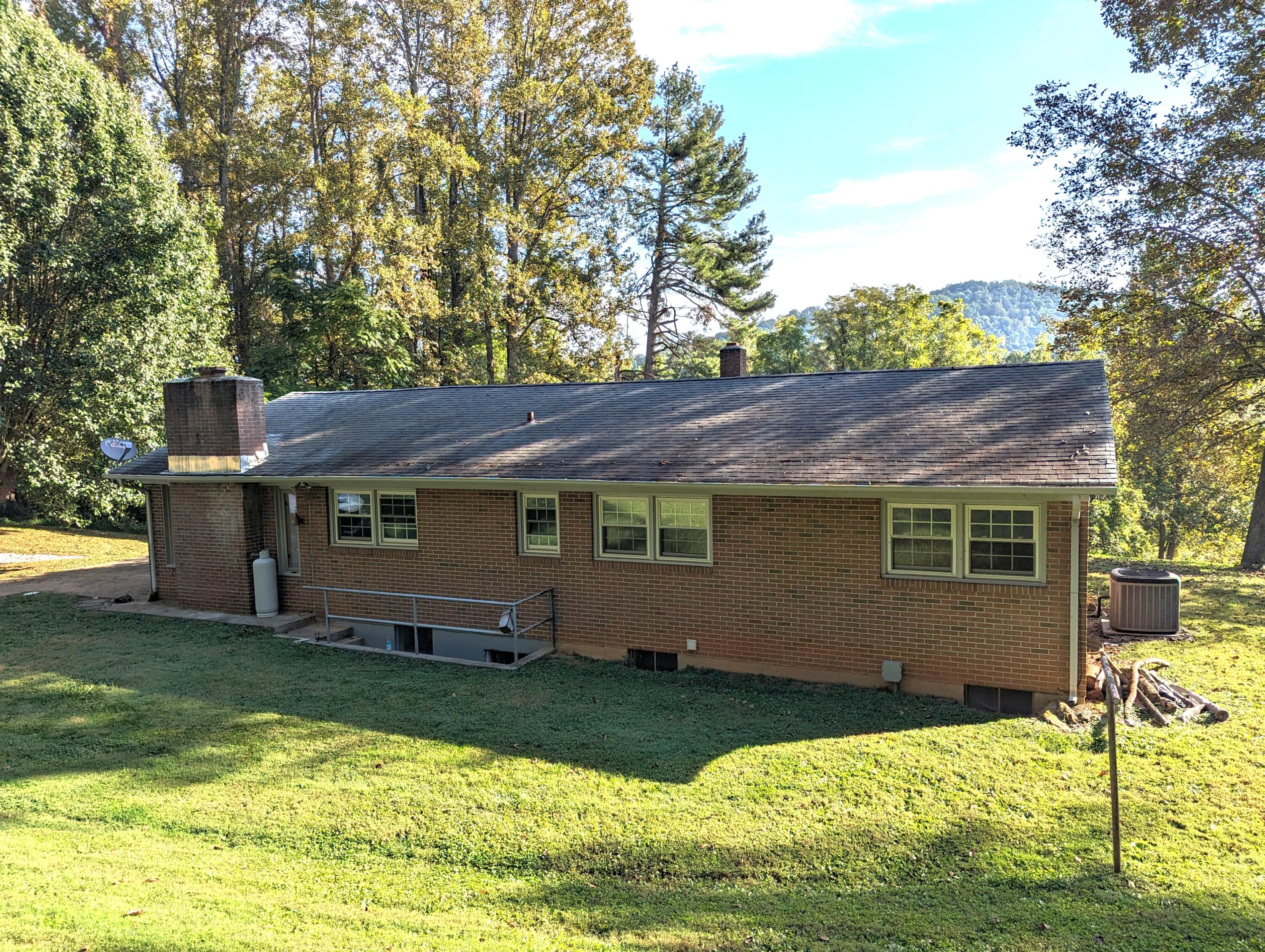 1769 Factory Hill Road Callaway, VA 24067 - Photo 37 of 53 a backyard of a house with yard table and chairs