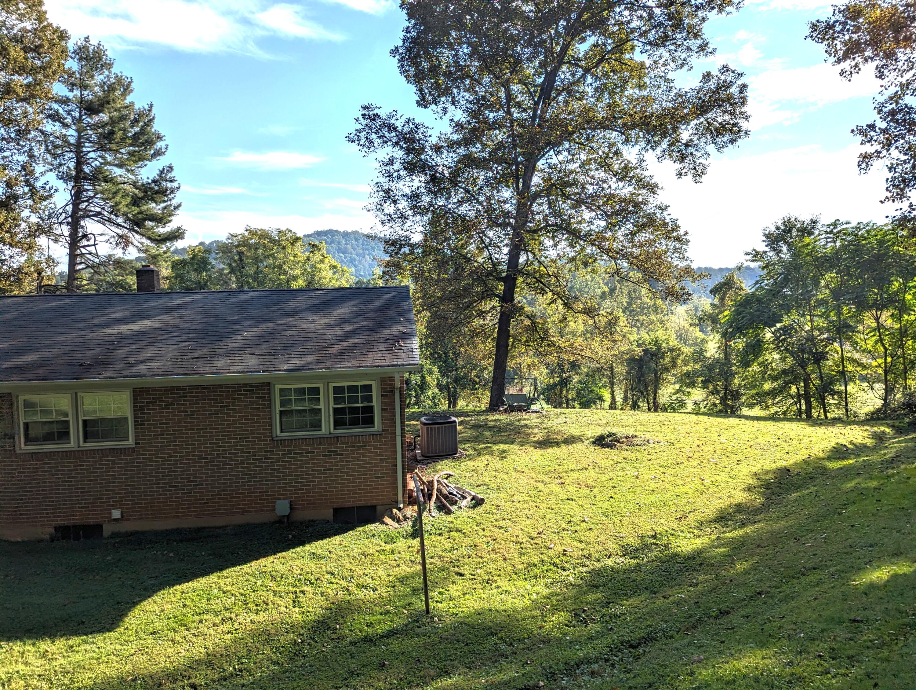 1769 Factory Hill Road Callaway, VA 24067 - Photo 38 of 53 a view of a backyard with a large tree