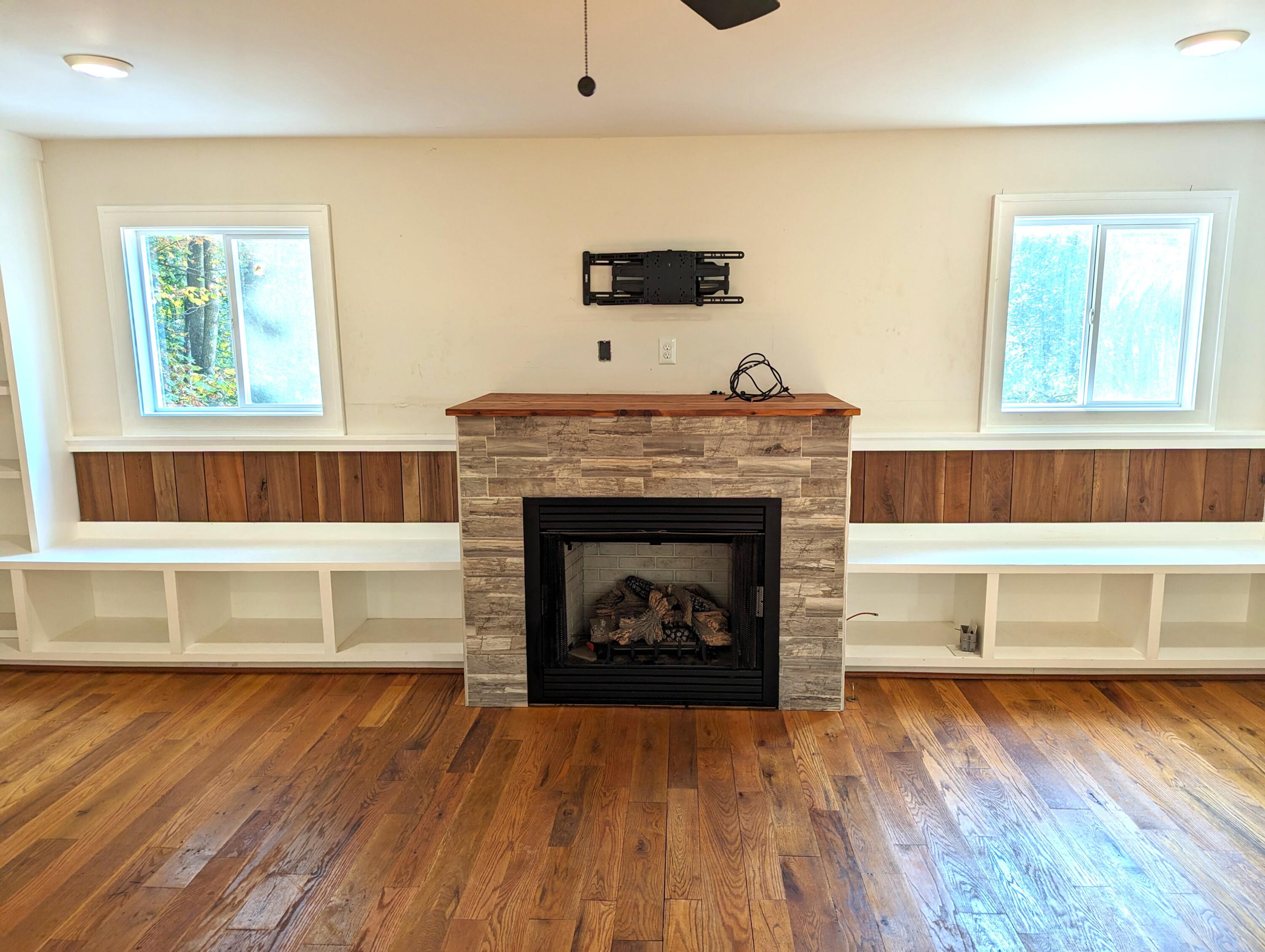 1769 Factory Hill Road Callaway, VA 24067 - Photo 5 of 53 a living room with a fireplace and a wooden floor