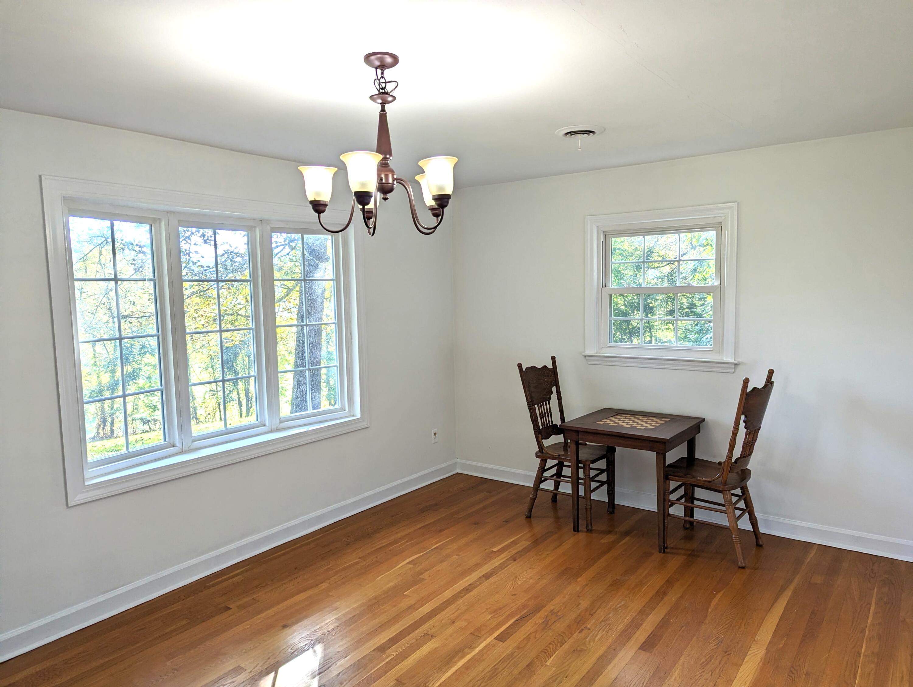 1769 Factory Hill Road Callaway, VA 24067 - Photo 10 of 53 a view of a dining room with furniture wooden floor and chandelier