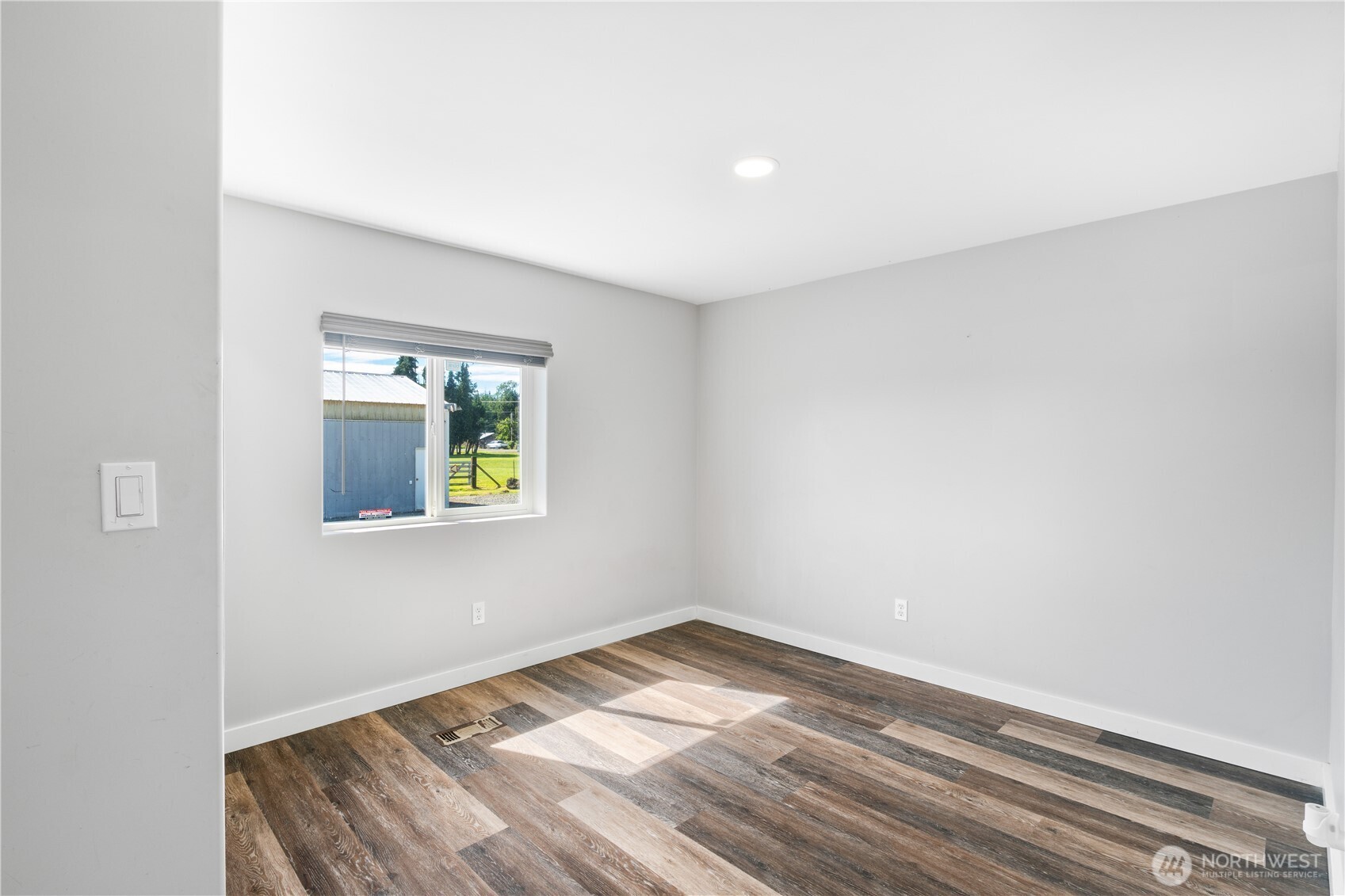 3471 Birch Bay Lynden Road Custer, WA 98240 - Photo 21 of 38 a view of empty room with wooden floor and fan