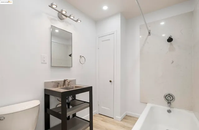 a kitchen with a stove a sink and a refrigerator