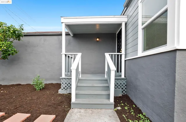 a view of entryway with wooden wall and potted plants