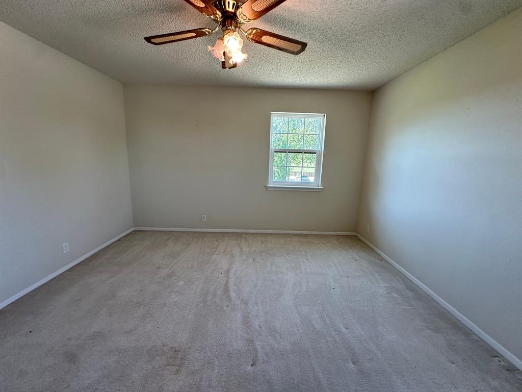 11552 Massey Road Pilot Point, TX 76258 - Photo 21 of 38 an empty room with a window