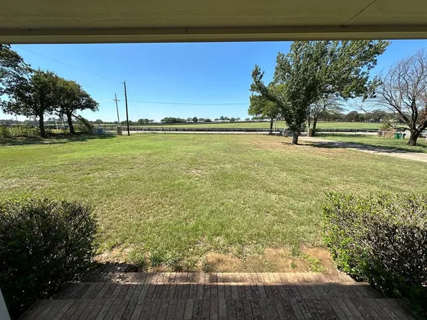 a view of swimming pool from a yard
