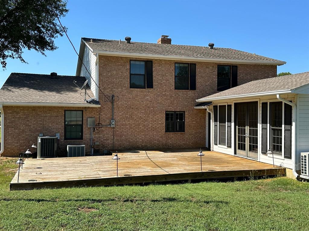 11552 Massey Road Pilot Point, TX 76258 - Photo 32 of 38 a front view of a house with a yard