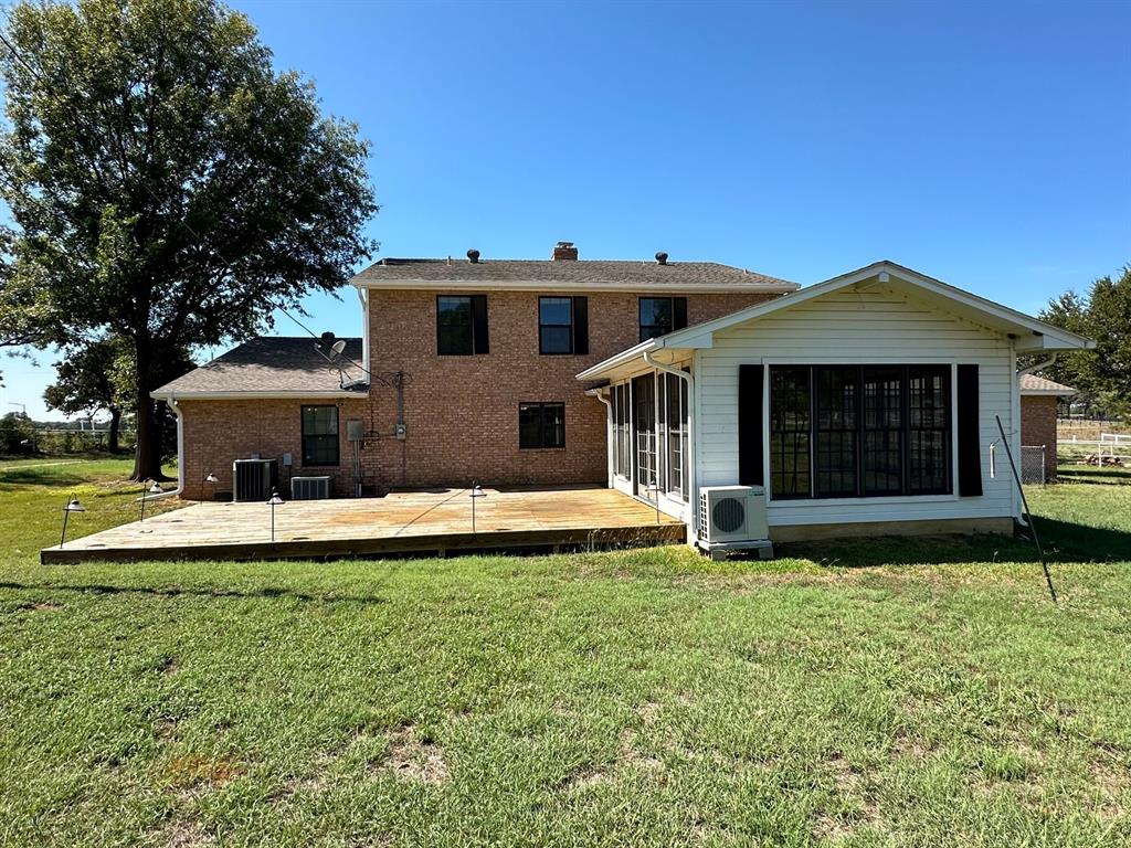 11552 Massey Road Pilot Point, TX 76258 - Photo 33 of 38 a front view of a house with a yard