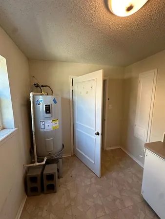 a kitchen with cabinets and white appliances