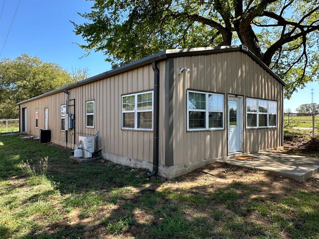 11552 Massey Road Pilot Point, TX 76258 - Photo 7 of 38 a house with trees in the background