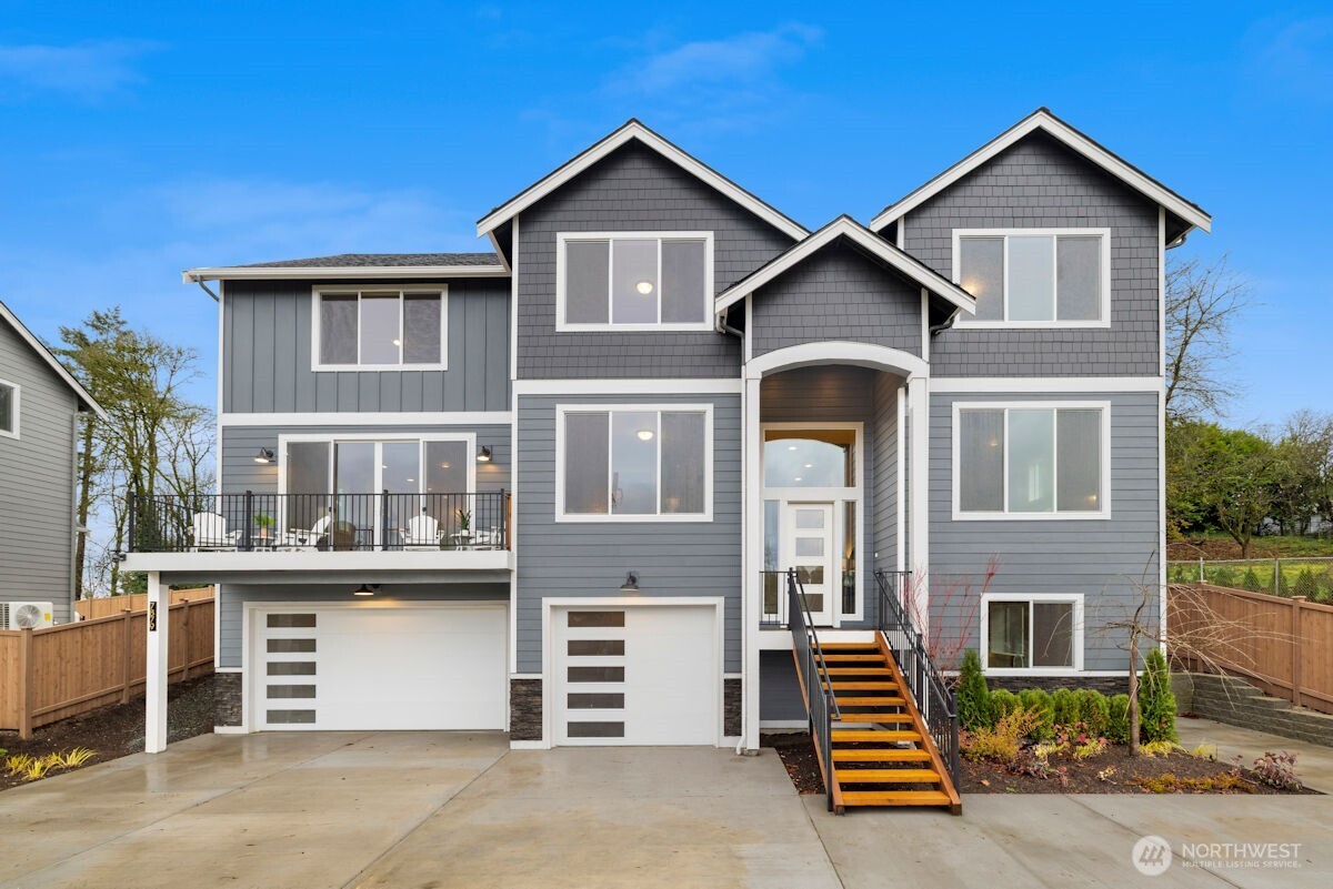 7879 South 132nd Street Seattle, WA 98178 - Photo 1 of 37 a front view of a house with a yard