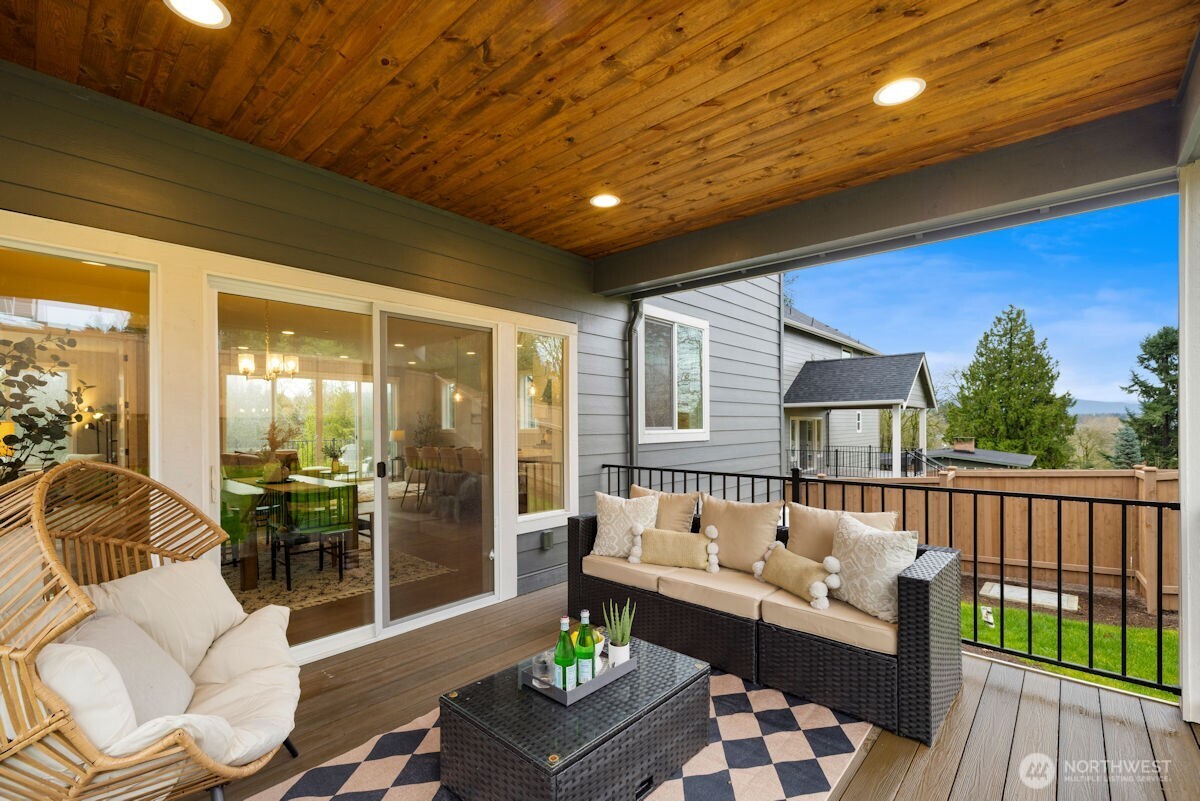 7879 South 132nd Street Seattle, WA 98178 - Photo 31 of 37 a balcony with furniture and wooden floor