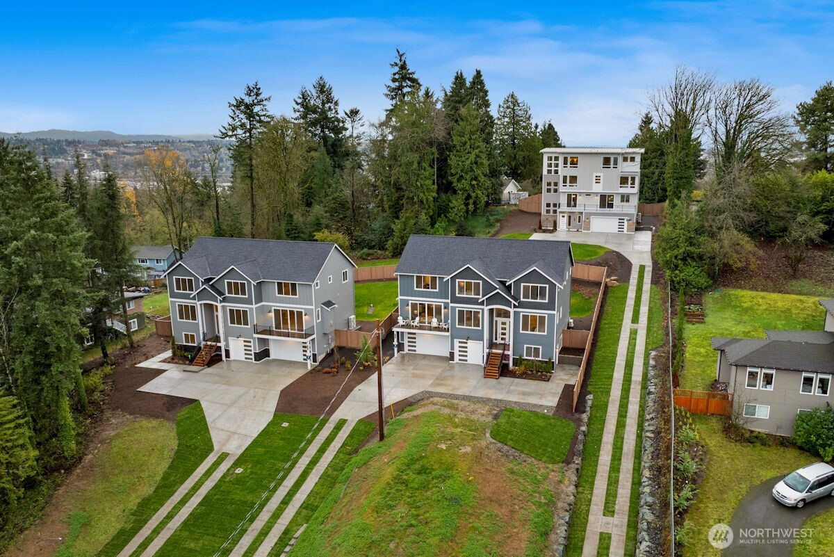 7879 South 132nd Street Seattle, WA 98178 - Photo 36 of 37 an aerial view of a house with swimming pool garden view and trees