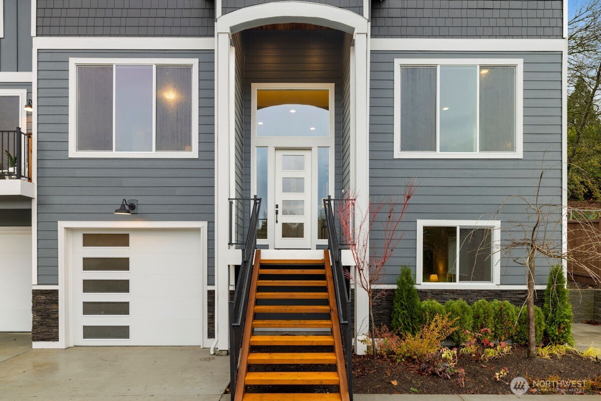 7879 South 132nd Street Seattle, WA 98178 - Photo 4 of 37 a front view of a house with a yard