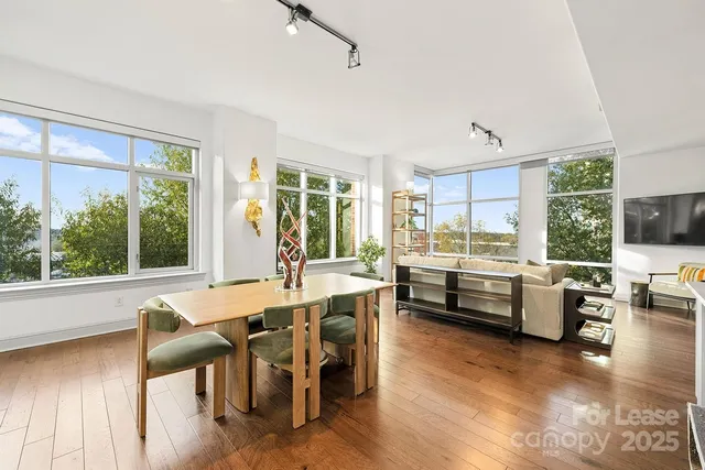 a dining room with furniture window wooden floor
