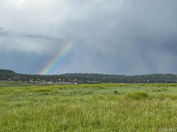 a view of sunset and a mountain