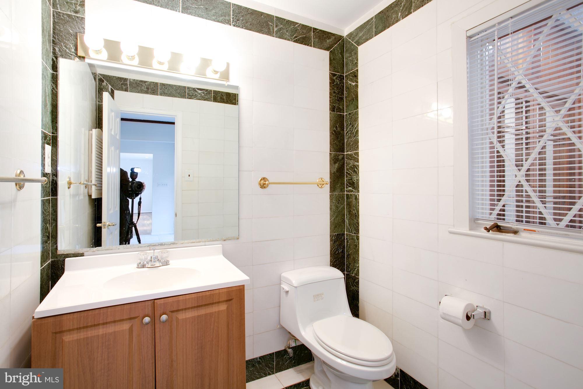 8107 Falstaff Road McLean, VA 22102 - Photo 5 of 29 Powder room on main level