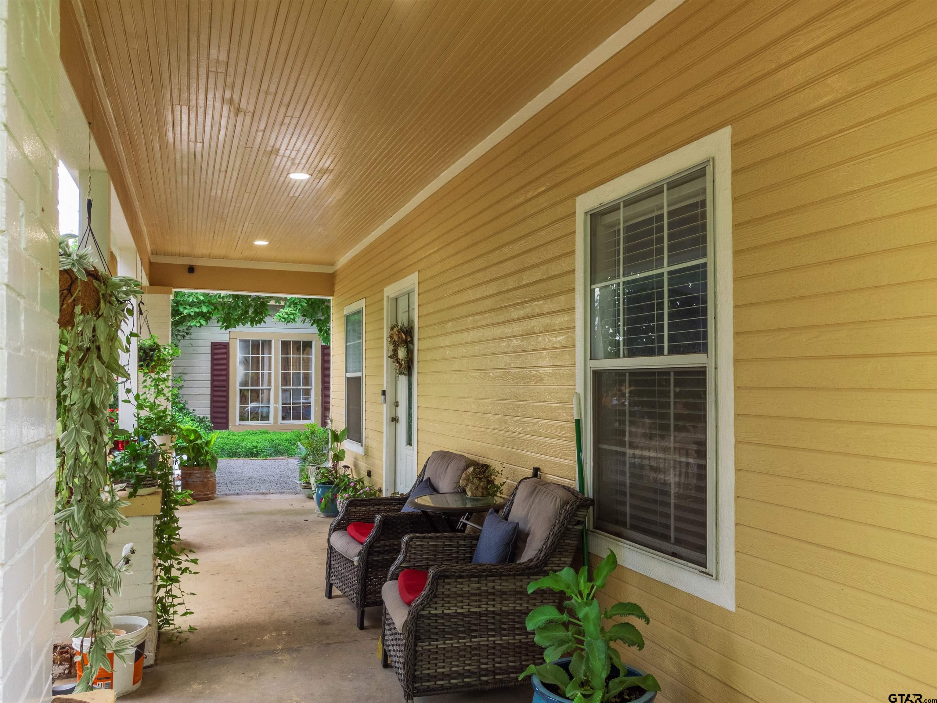 427 East Locust Street Tyler, TX 75702 - Photo 4 of 42 a backyard of a house with seating space