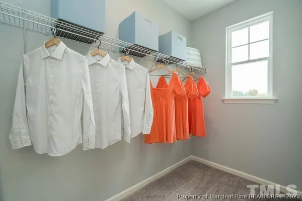 a view of walk in closet with window