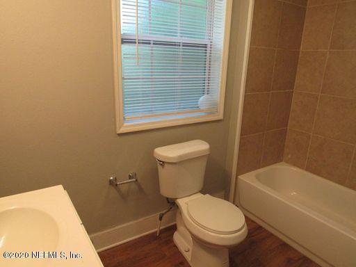 4909 Ave B Jacksonville, FL 32209 - Photo 16 of 17 a white toilet sitting next to a bath tub