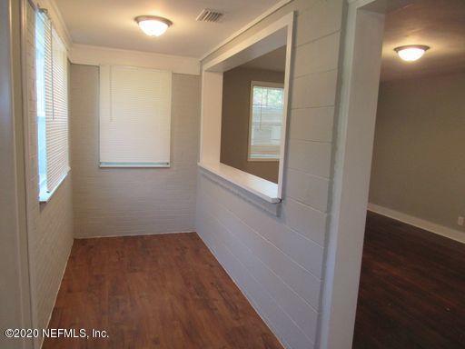 4909 Ave B Jacksonville, FL 32209 - Photo 2 of 17 a view of small space with wooden floor and a window