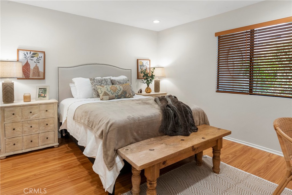 2172 Biscayne Costa Mesa, CA 92627 - Photo 15 of 18 a bedroom with a bed a lamp and a window