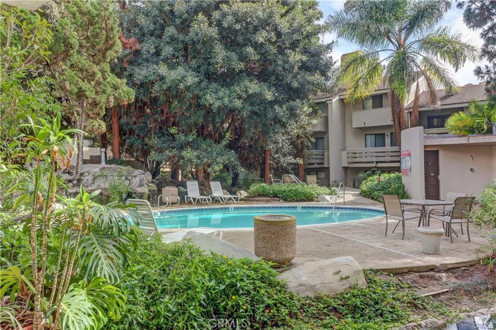 2172 Biscayne Costa Mesa, CA 92627 - Photo 18 of 18 a view of a house with garden and a tree