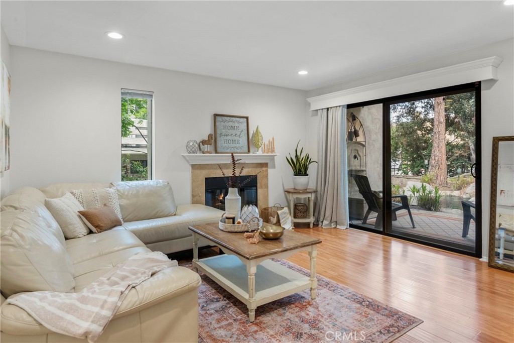 2172 Biscayne Costa Mesa, CA 92627 - Photo 2 of 18 a living room with furniture and a fireplace