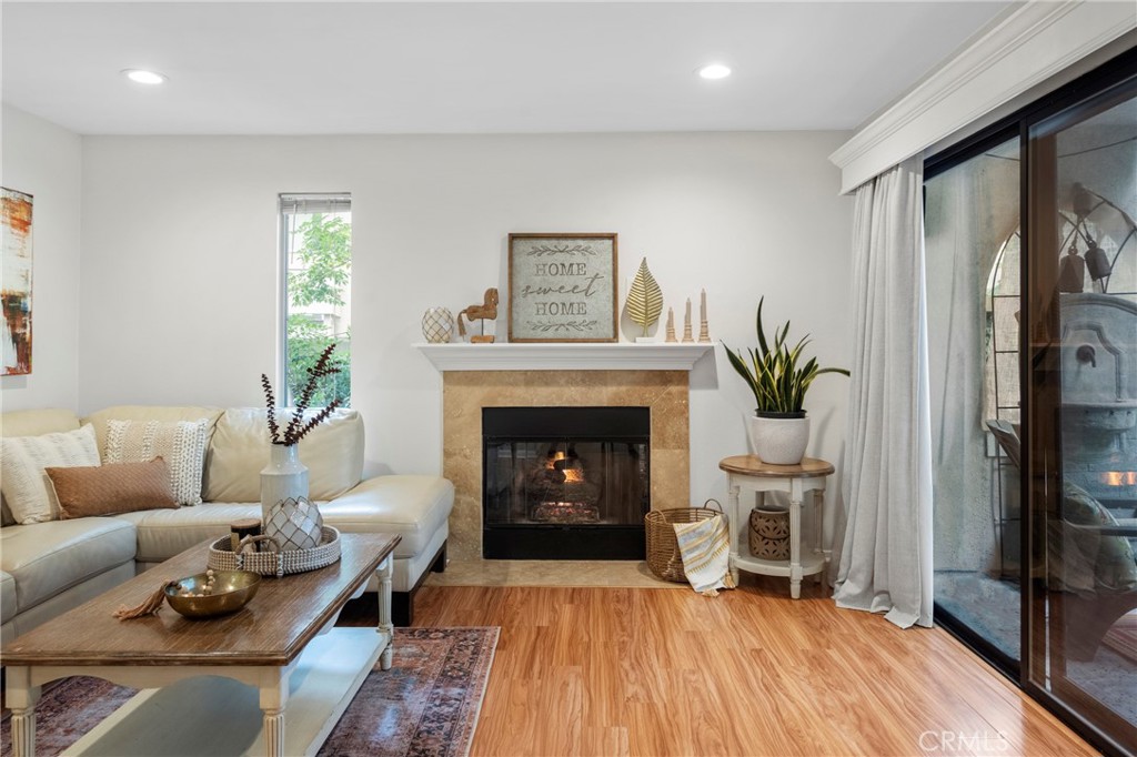 2172 Biscayne Costa Mesa, CA 92627 - Photo 3 of 18 a living room with furniture and a fireplace