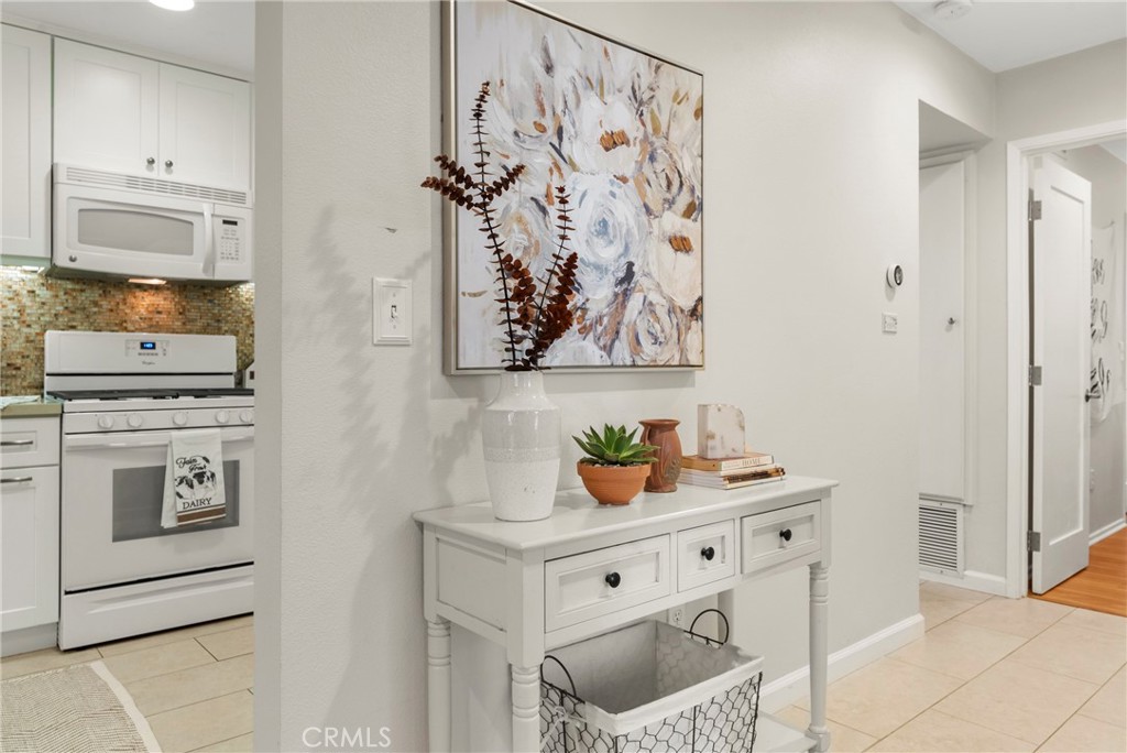 2172 Biscayne Costa Mesa, CA 92627 - Photo 9 of 18 a kitchen with stainless steel appliances a stove and a refrigerator