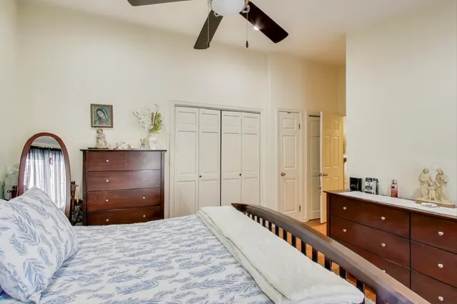 a bedroom with a bed and a dresser