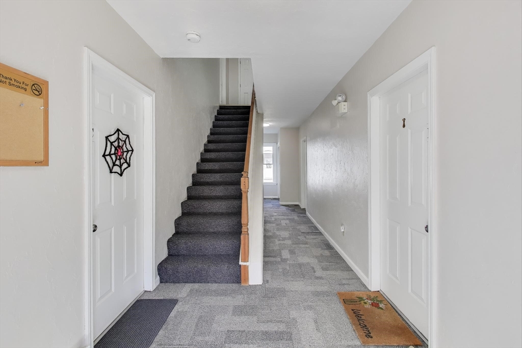 425 Main Street, Unit 11B Hudson, MA 01749 - Photo 4 of 26 a view of entryway and hall with wooden floor
