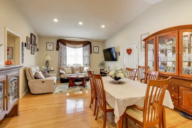 a living room with fireplace furniture and a flat screen tv